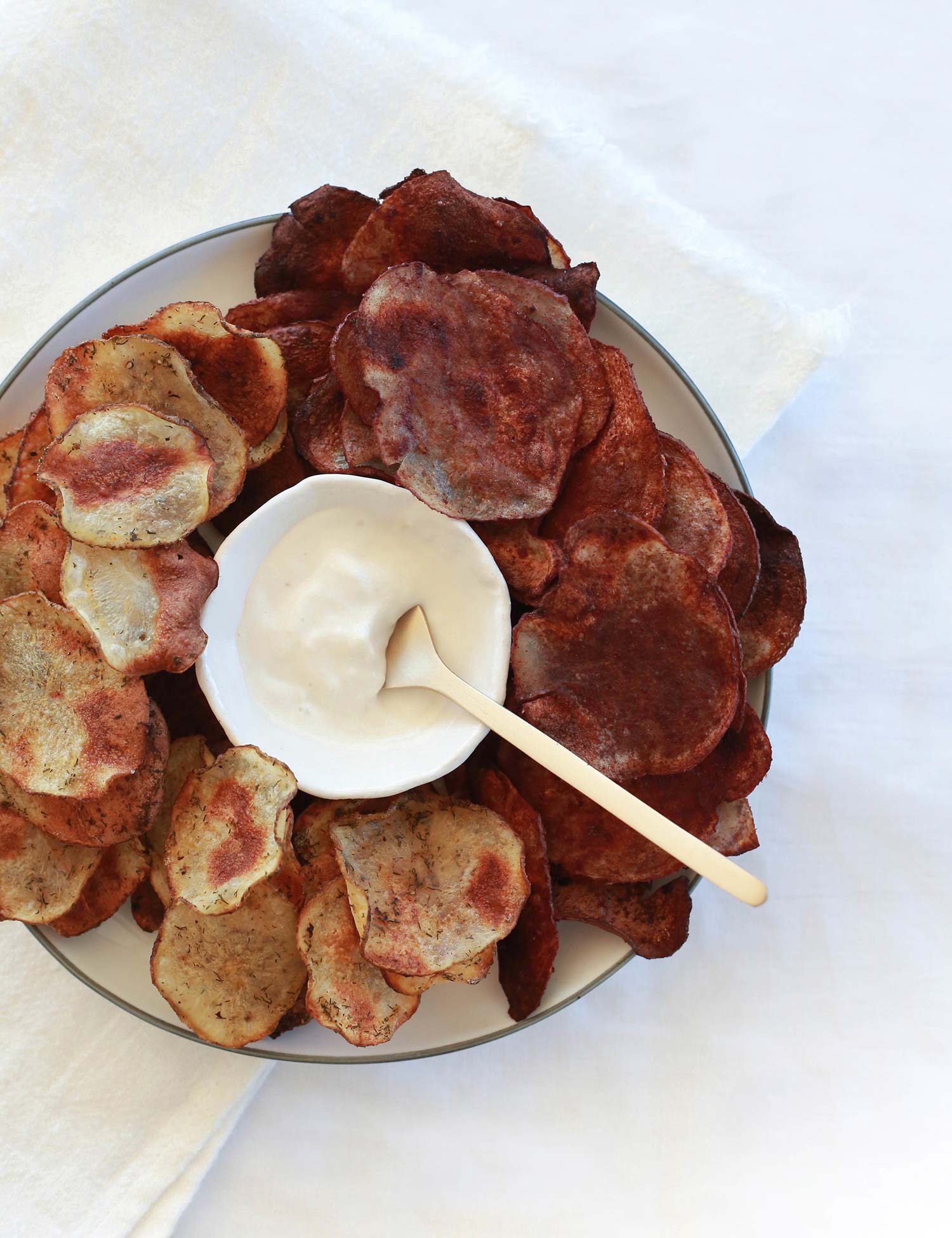 Potato Chips 2 flavours of potato chips on a plate with dip in the middle
